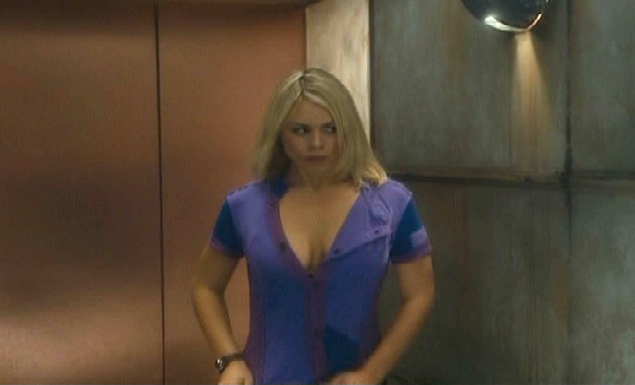 Billie Piper straightens her top